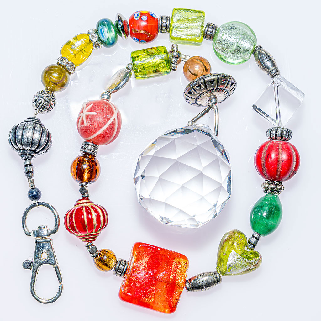 Bring beautiful light and colour into your home with this handcrafted crystal suncatcher. - Suncatcher Circus