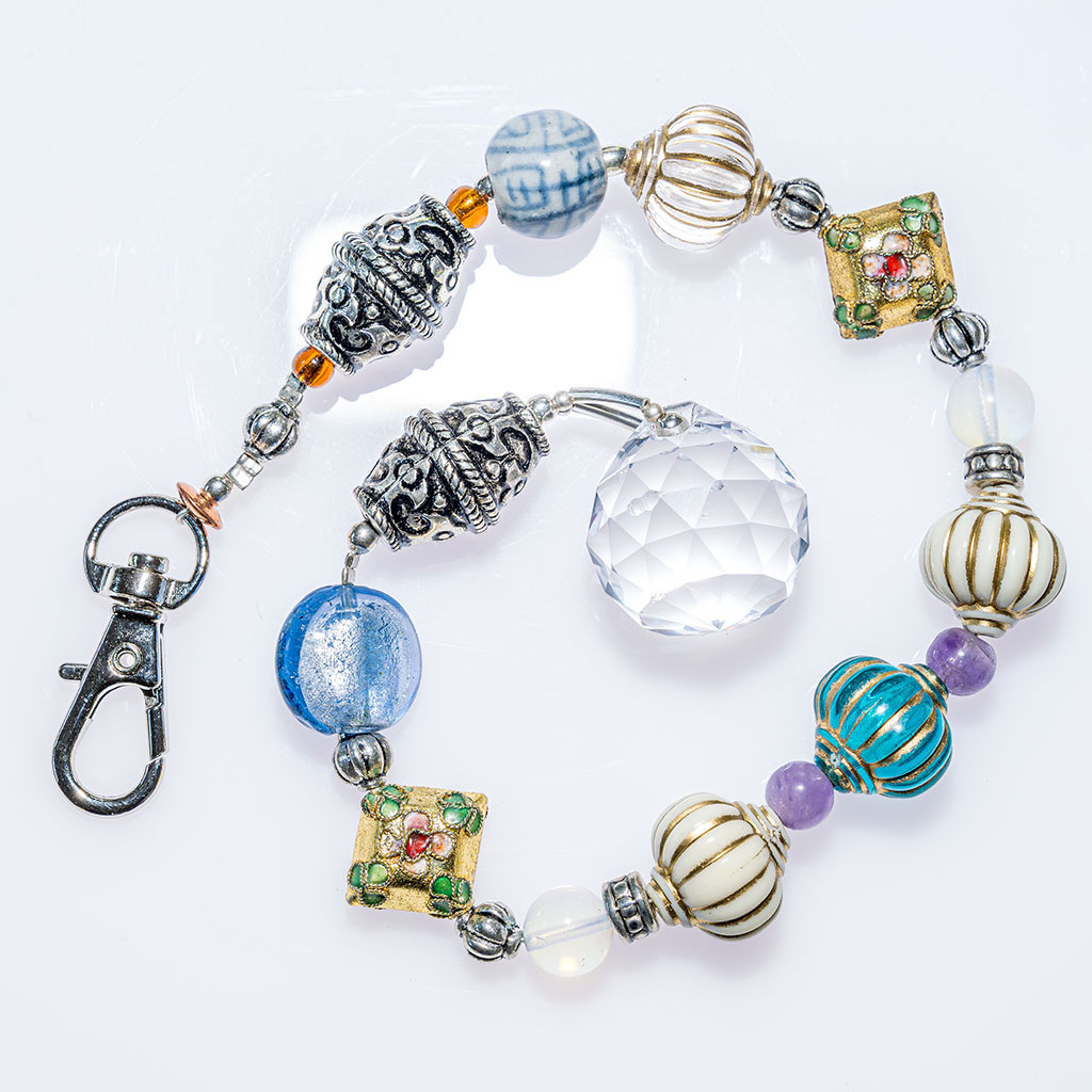 Suncatcher with small blue and white faceted beads